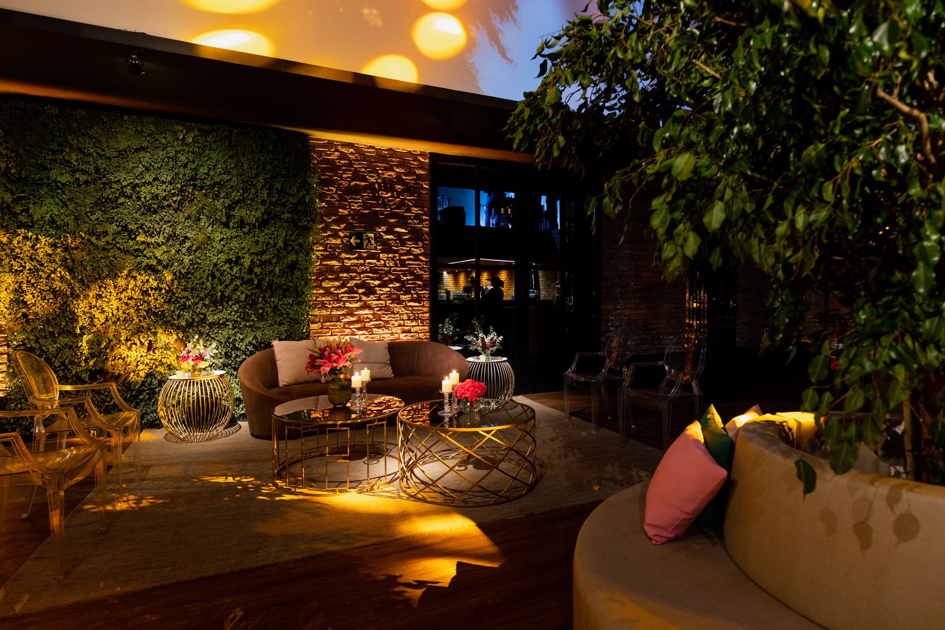 Inviting lounge area with elegant seating and vibrant lighting, perfect for relaxation and socialization. — Allen over legale