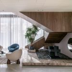Chic interior showcasing a modern staircase, elegant seating, and decorative elements. — Lorem ipsum dolor sit amet